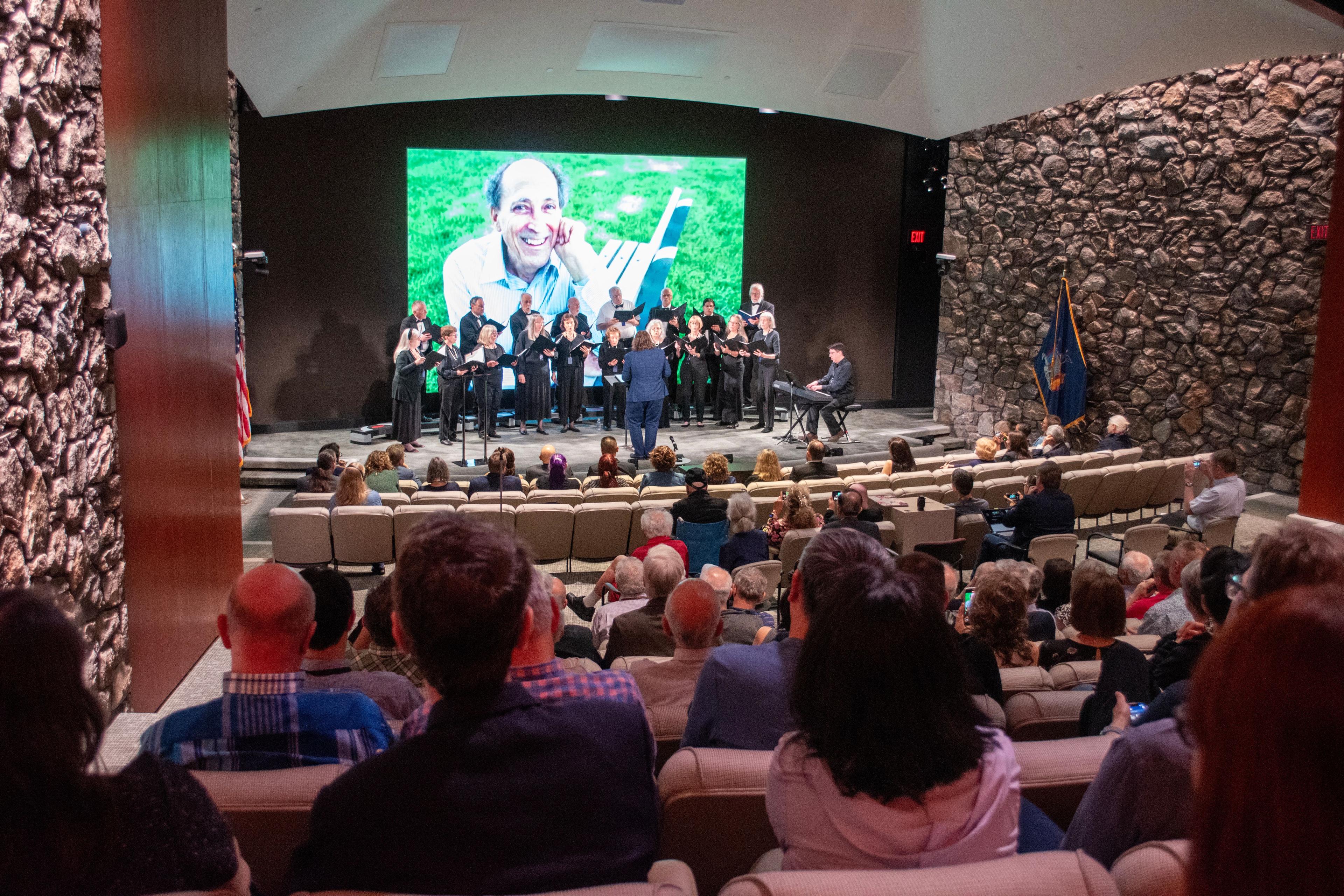 The Taghkanic Chorale, seen here performing at Bob Dennard's memorial service, was one of his great passions outside of the lab.