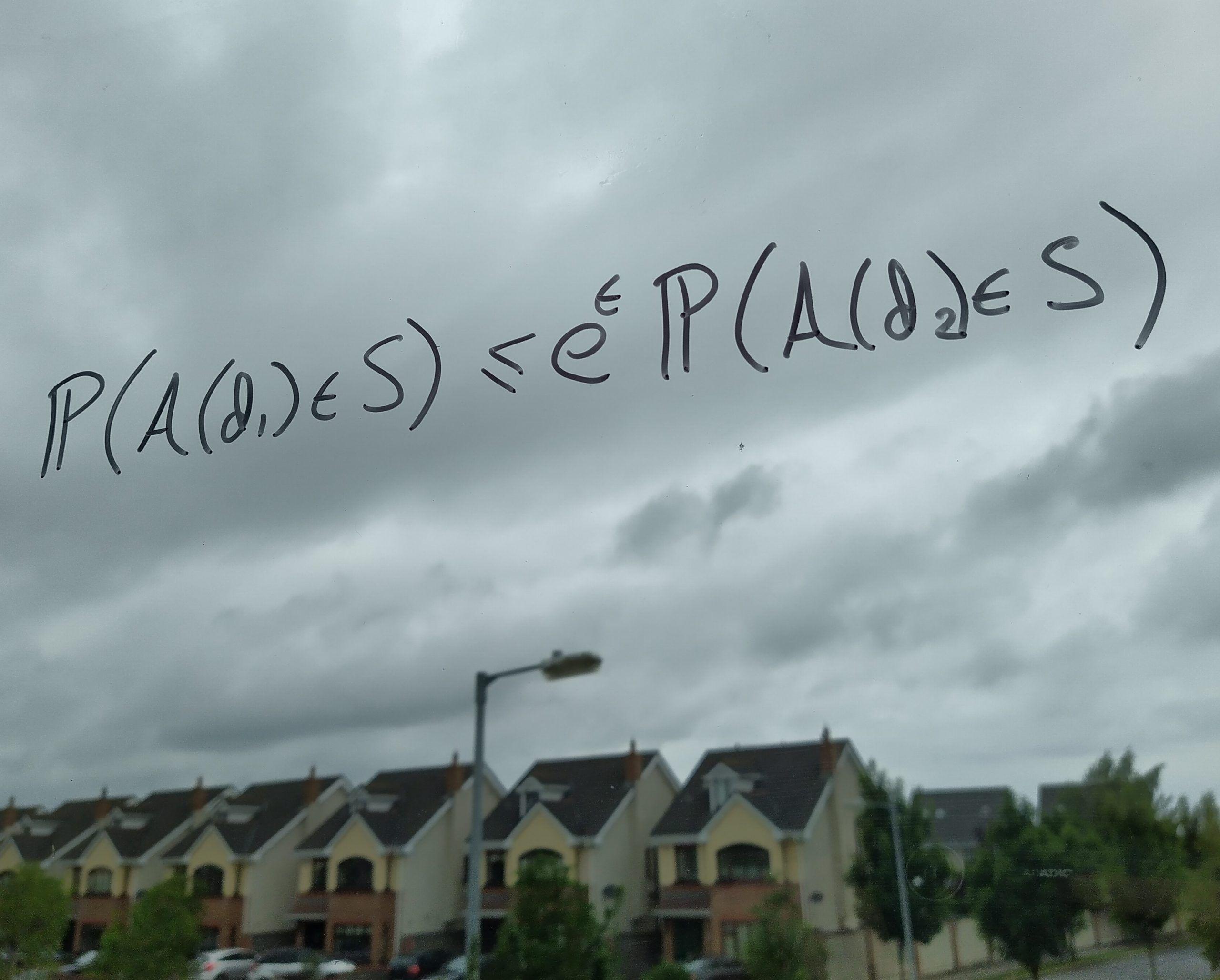 A photo of the equation written in marker on a window.