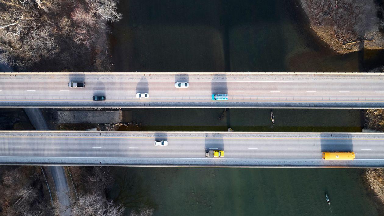 aerial photograph of a bridge with cars on it